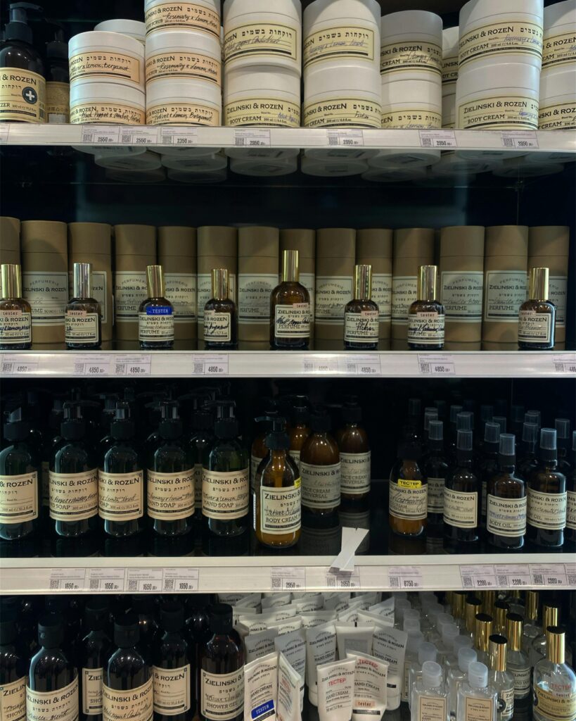 Variety of beauty products displayed on store shelves, perfect for skincare and aromatherapy enthusiasts.